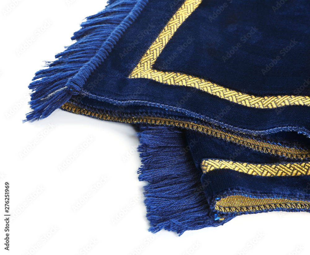 Muslim prayer mat on white background