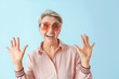 © Pixel-Shot - Happy mature woman on color background