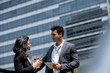 © Atstock Productions - Indian businessman having outdoor meeting with client