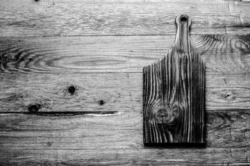 Wall Mural - Handmade burned cutting board on a wooden rustic texture for background. Rough weathered wooden board. Toned