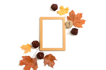 photo frame mockup with frame made from dry maple leaves and rattan balls on white background
