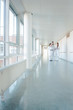 © Kzenon - Three doctors on hospital corridor having short meeting