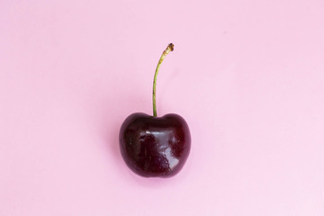 Wall Mural - Cherry fruit Isolated on pink background. beautiful pink concept top view