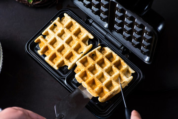 Waffles baking on a waffle maker