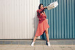 © Kantemir Production - Young and nice lady, happy with shopping. Dress in summer pocket and packs in hand. Place for text placement