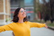 © bnenin - Beautiful young woman enjoying on a sunny day, with her arms open.