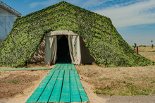 Large Military Tent Covered With Camouflage Net