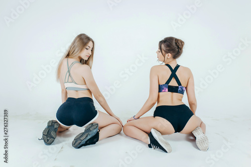 Two Beautiful Womans Dancing Booty Twerk Sitting On The Floor On A