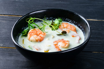 Sticker - Vegetable cream soup with shrimps and croutons in white bowl close up