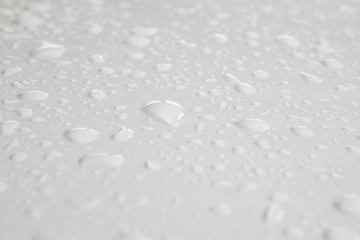 Wall Mural - water drop on white background drops of rain on car