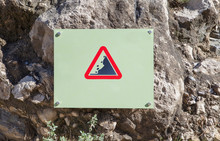 Landslide Caution Falling Rocks Sign Attached To The Rock