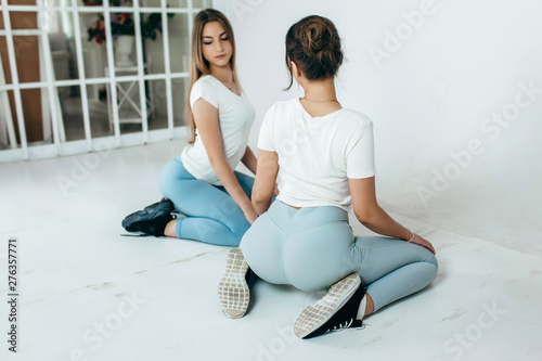 Two Beautiful Womans Dancing Booty Twerk Sitting On The Floor On A