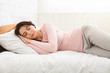 © Prostock-studio - Beautiful young woman sleeping in her bed