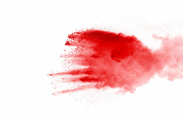 Wall Mural - Explosion of red dust on white background.