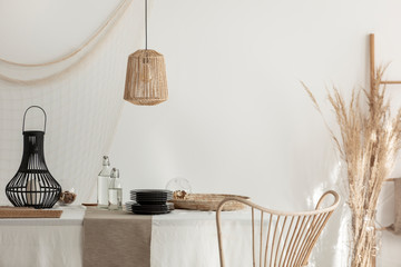 Wall Mural - wicker lamp and chair in dining room