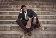 © SB Arts Media - Sad business man suffering from depression in total despair hopeless and frustrated in city stairs