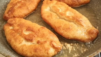 Sticker - Potato patties are fried in a pan