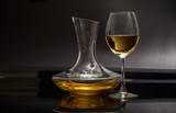 Fototapeta Lawenda - A glass full of wine and wine decanters