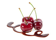 Three Cherries In Chocolate On A White Background