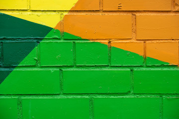 Abstract bright street colorful drawing detail of brick wall, like as graffiti closeup. Can be useful for backgrounds