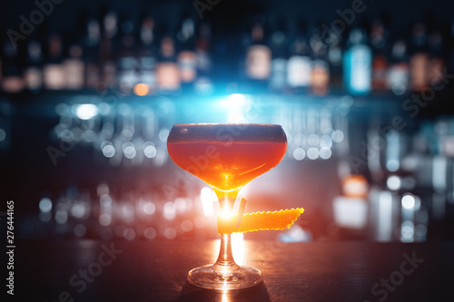Cuadros en Lienzo glass of fresh orange cocktail on blue background