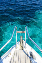(Selective Focus) Stunning View Of A Bow Of A Yacht Sailing On A Beautiful Turquoise And Transparent Sea. Costa Smeralda (Emerald Coast) Sardinia, Italy. 