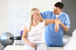 © Pixel-Shot - Physiotherapist working with mature patient in rehabilitation center