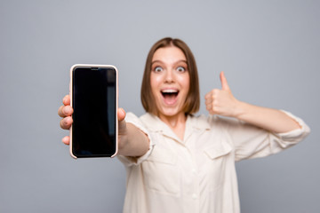 Canvas Print - Close up photo crazy beautiful she her lady hands arms telephone raise thumb up yell scream shout advising customer buy buyer device low price wear casual white shirt isolated grey background