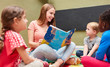 Teacher or childminder reading aloud