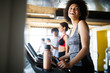 © NDABCREATIVITY - Group of healthy fit people at the gym exercising