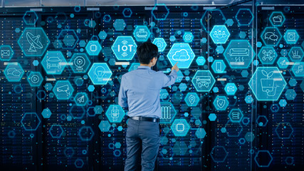 Aufkleber - Concept of Cloud Data Storage. Shot In the Modern Data Center: IT Engineer Standing Beside Open Server Rack Cabinet and Touching Digital Illustrative Icons with Different Symbols and Visualisations.