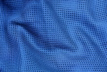 Blue Fabric Texture From Crumpled Mesh To A Piece Of Cloth