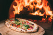 © tankist208 - tasty pizza out of oven in restaurant kitchen