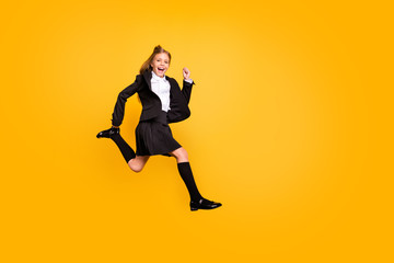 Wall Mural - Full length photo of funny kid running activity laughing screaming shouting isolated over yellow background