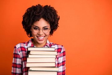 Sticker - Close up photo beautiful positive she her lady hold arms hands many books prepare examination glad return back school toothy wear casual checkered plaid shirt isolated bright orange background