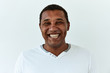 © PinkCoffee Studio - African American man portrait against white background. Laughter and joy emotions