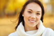 © Syda Productions - season and people concept - portrait of happy young woman smiling in autumn park