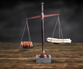 Wall Mural - Law scales on table background. Symbol of justice