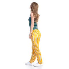 woman in yellow pants smiling happiness standing looking on white background isolation, back view