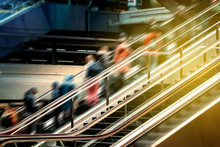 People On Escalator Inside  Train Station , Travel Concept Blur -