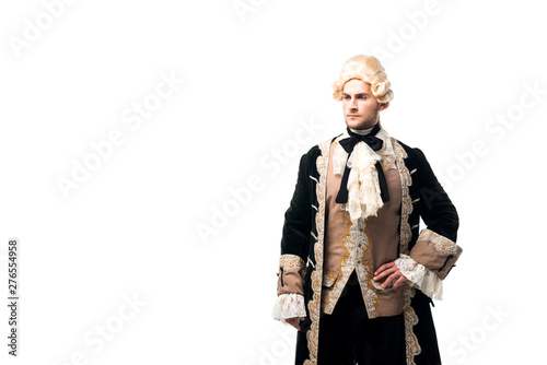 Photographie handsome victorian man in wig standing with hand on hip isolated on white