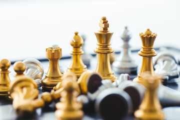 Gold Chess on chess board game for business metaphor leadership.Chess board game for ideas and competition and strategy,business success concept.