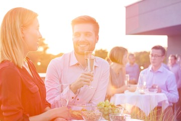 Canvas Print - Business people on a rooftop party.