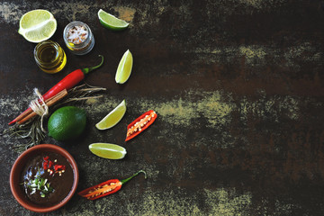 Wall Mural - Chili lime sauce Ingredients for chili sauce and lime. Chili, limes and spices. Vegan food. Dietary healthy food. Copy space. Flat Lay.