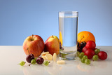 Fototapeta Most - A glass of pure water with fruit and effervescent soluble vitamins in tablets.