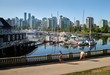 © maxdigi - Stanley Park Coal Harbor Seawall. Stanley Park reflections in Coal Harbour by the Vancouver Rowing Club.