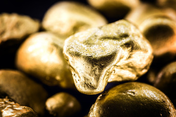 Poster - gold texture, many gold nugget, stone of value. Crude gold drawn on black background. Concept of wealth or luxury.