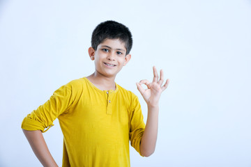 Wall Mural - young indian boy showing fingers