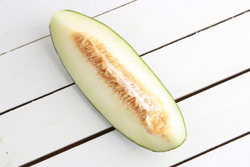 Poster - delicious piece of melon on white background