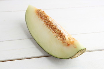 Poster - delicious piece of melon on white background